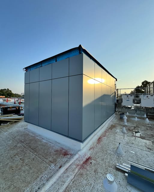 Exterior panel installation on a rooftop structure